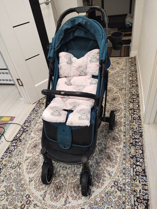 Бала сүйрететін арба. Коляска детский