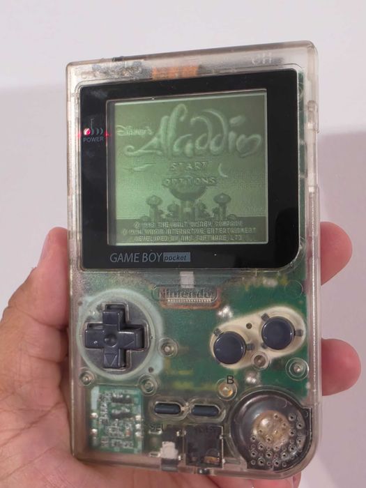 Nintendo Gameboy Poket transparent editie limitata si joc Aladdin