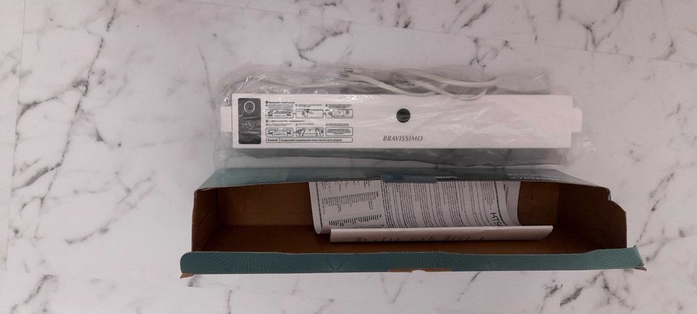 Машинка за вакумиране.