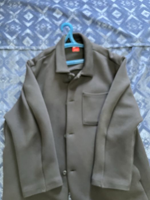 Серое пальто Nike