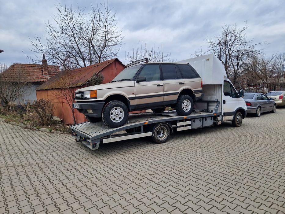 Tractari auto transport Romania Spania pe platforma dube utilaje