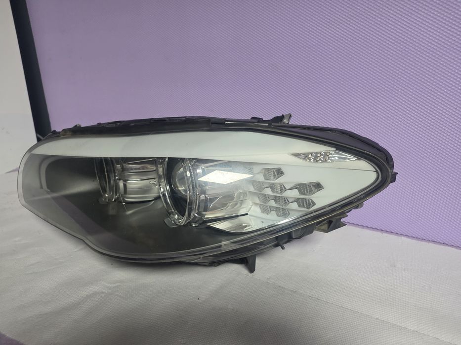 Far stanga BMW Seria 5 F10 F11 Bi-Xenon LED original HELLA 7203245
