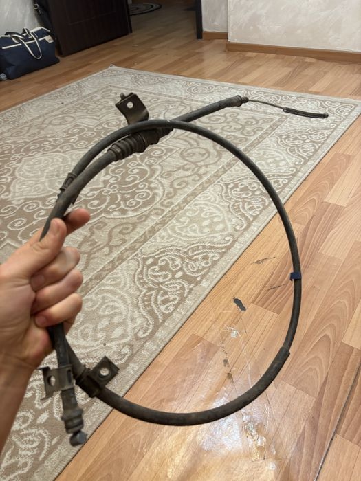 Трос ручника привозная