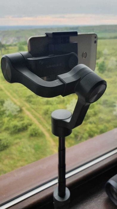 Stabilizator Ghimbal telefon, Feiyu-Tech, 3 axe, pentru stabilizare foto si video, cu braț telescopic și trepied, ca NOU