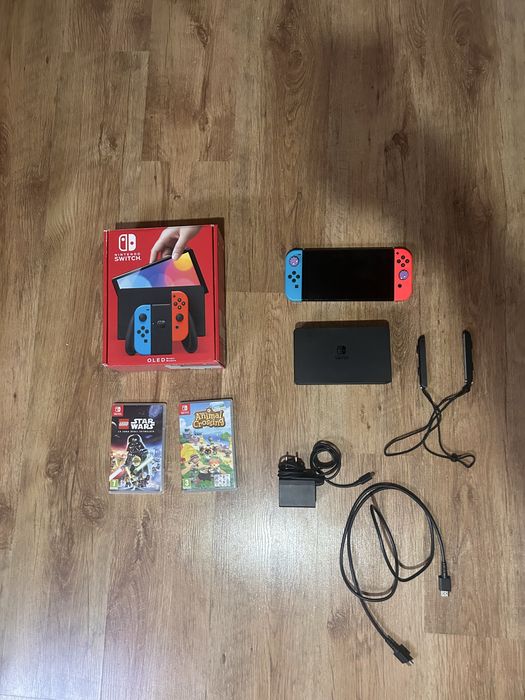 Nintendo Switch OLED + 2 jocuri + cutie + accesorii