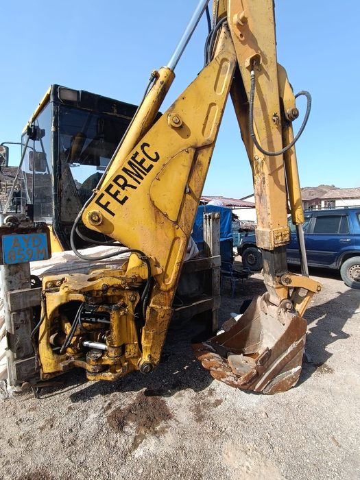 Экскаватор погрузчик 3в1 Фермег английский