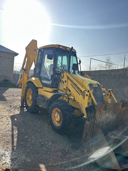 Экскаватор погрузчик 3в1.