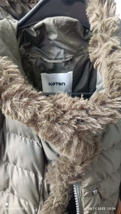 Женский пуховик-пальто.