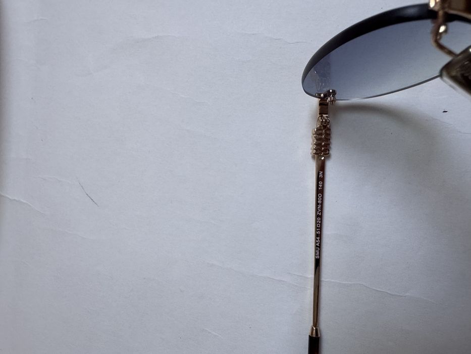 Ochelari de soare Miu Miu Oval-Rimless SMUA54 51-20 140, Noi