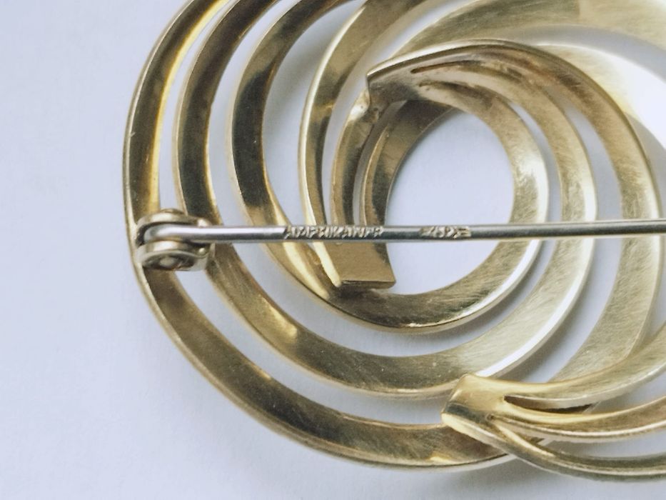 Veche brose placata cu aur, Amerikaner