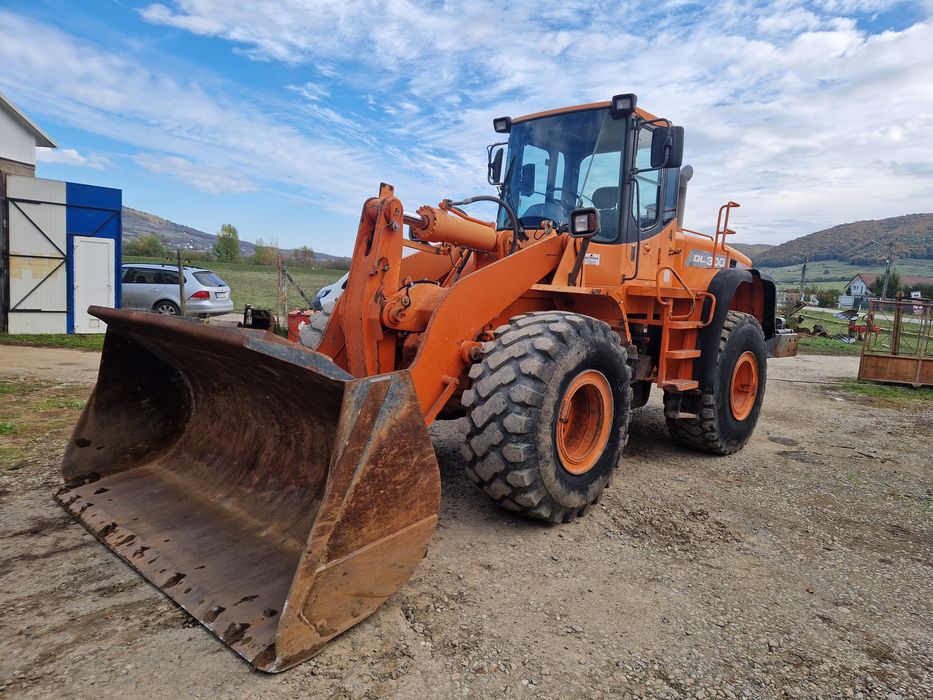 Încărcător frontal, Vola