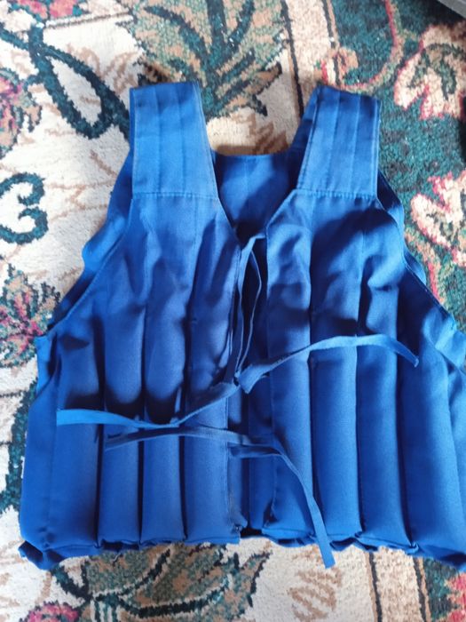 Жилет утежалитеь