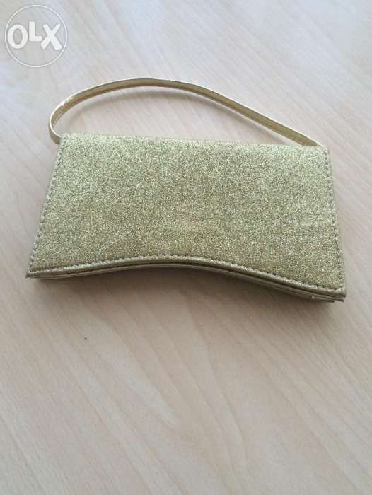 Vând geanta glitter auriu