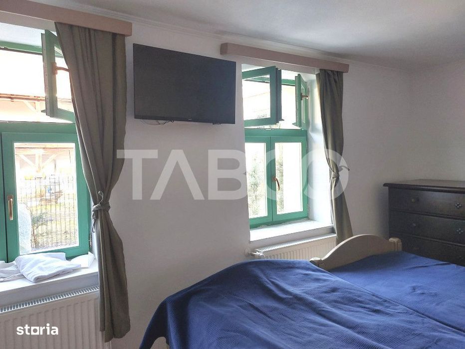 Apartament de vanzare 105 mp 3 camere curte 340 mp in acte Cisnadie