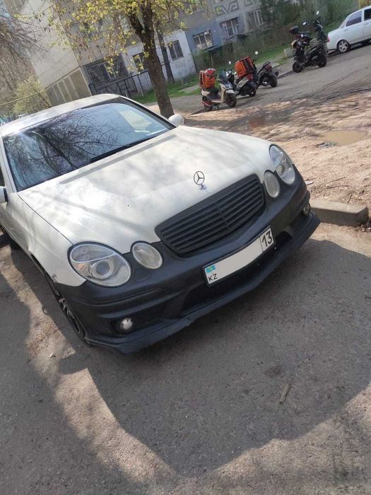 Бампер Mercedes W211 AMG рестайлинг
