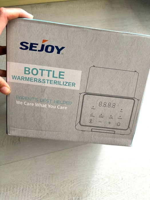 Мултифункционален Затоплящ и стерилизиращ уред за две бутилки.