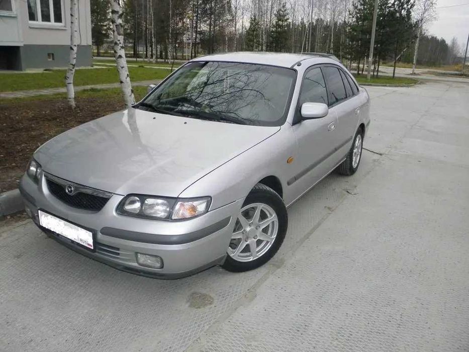 Крыло на Мазда 626 98-/Mazda 626 -99