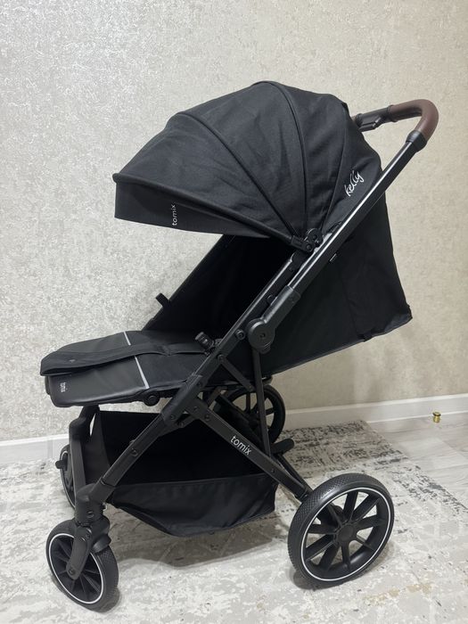 Продам новую коляску Tomix kelly черный