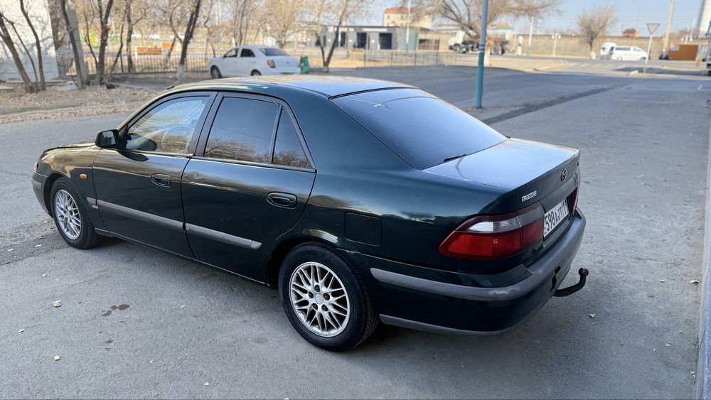 Мазда 626 птичка