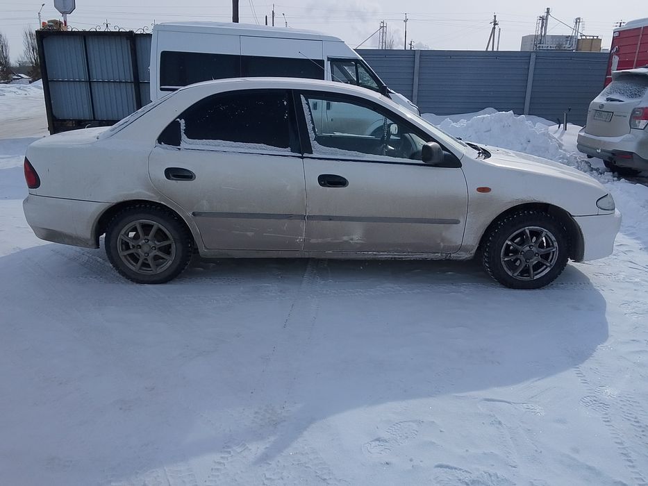 Мазда 323 j 96 год