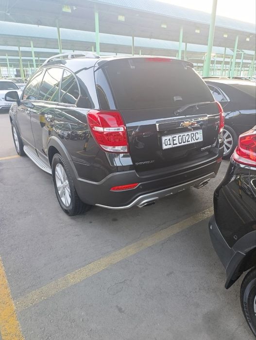 Chevrolet Captiva. 2013 цвет чёрный, состояние отличное.