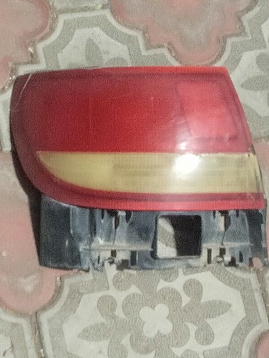 Тойота Карина Е задний левый фонарь оригинал.