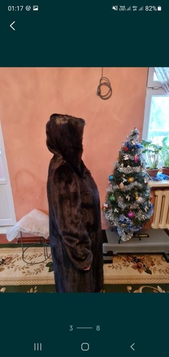 Норкавая шуба с капюшоном.