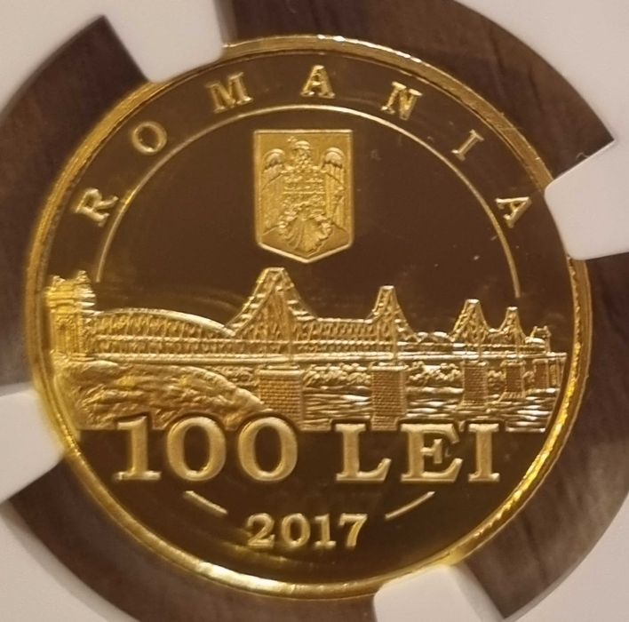 Moneda aur BNR 100 Lei, parteneriat Romania-SUA, gradata NGC PF 67 UC