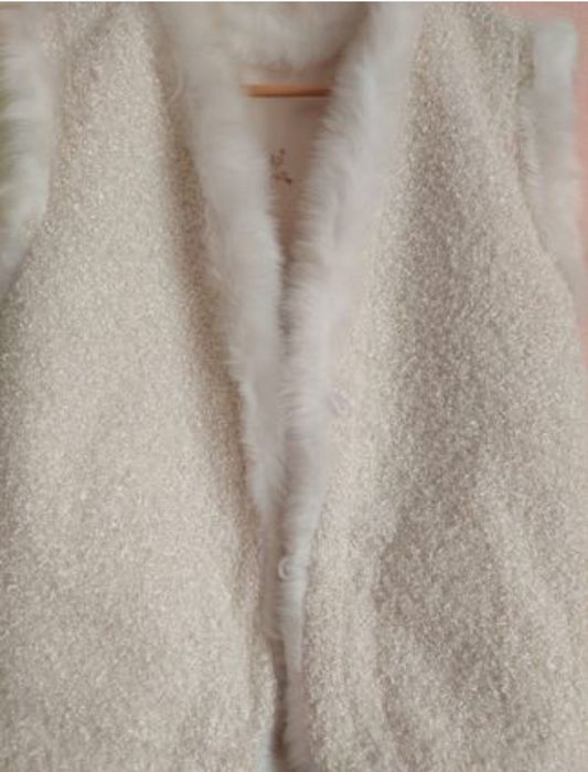 Меховые жилеты женские