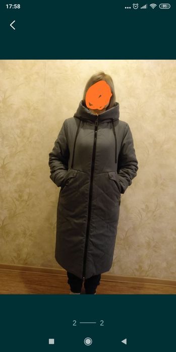 Женский пуховик .