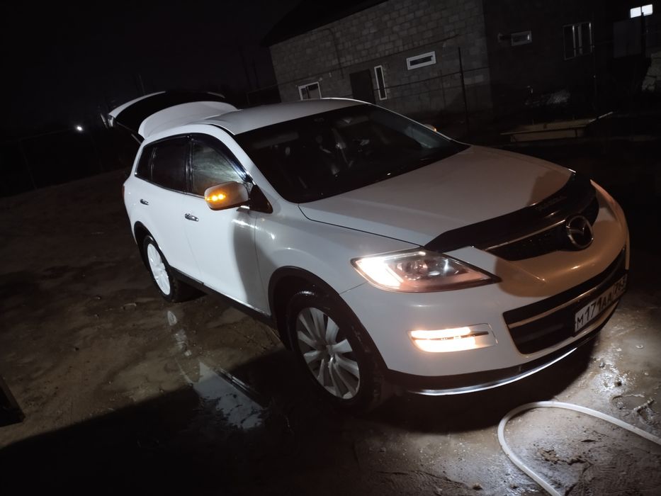 Мазда  С Х 9 белая