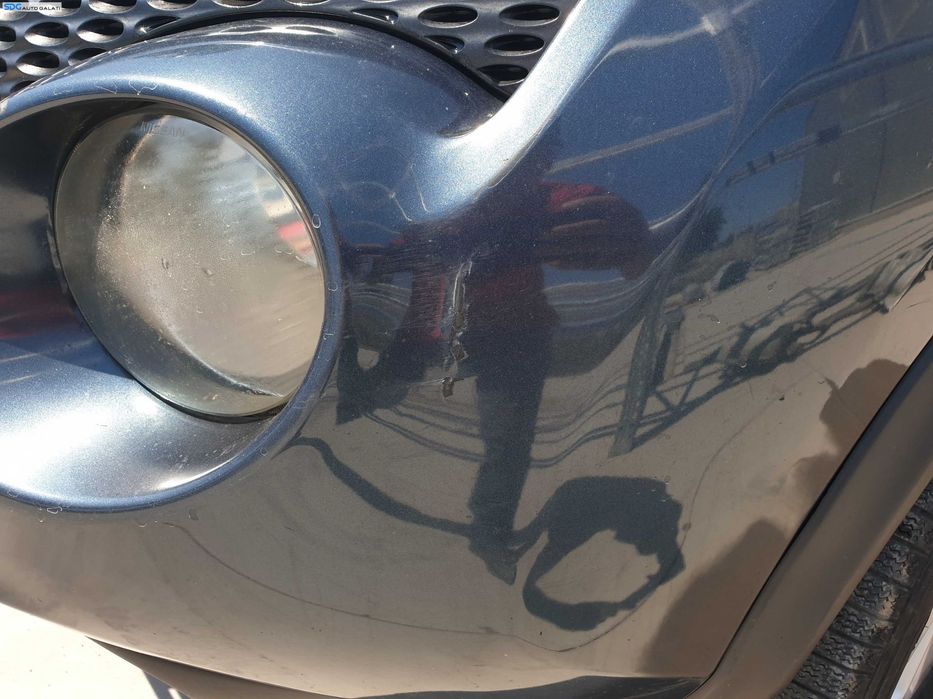 Bara Spoiler Fata cu Proiectoare FARA Grila cu Emblema Nissan Juke F15 NFL Non Facelift 2010 - 2014 Culoare RAQ [K6302]