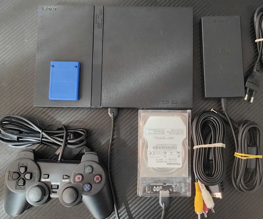 Playstation 2 model slim,modat, cu 33 jocuri de top ,maneta ,cabluri