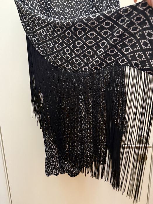 Екстравагантен гащеризон с ресни по ръкавите