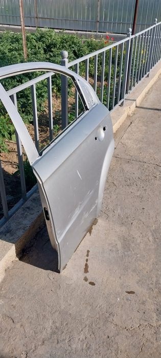 Эшик Нексия 3 чап томон орка.Колпак хам бор оригинал.