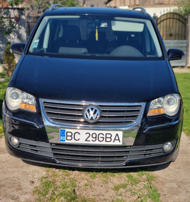 Vând W  Touran 2.0 7 locuri navigatie mare cu touch