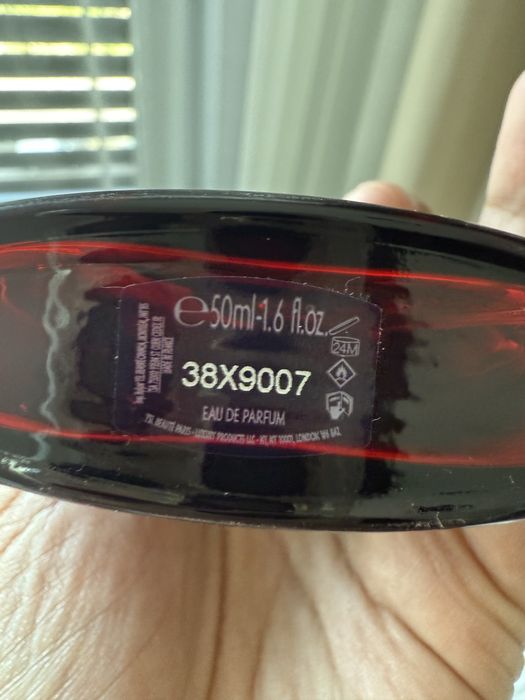 YvesSaintLaurent Black opium eau de parfum over red