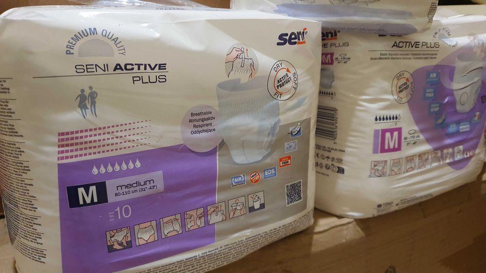 Scutece pentru adulți şi lenjerie de pat impermeabilă