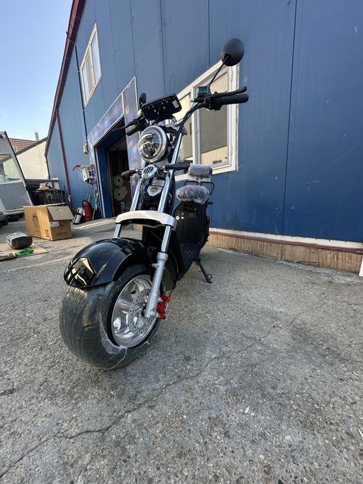 scuter electric model cu cartelă 2026