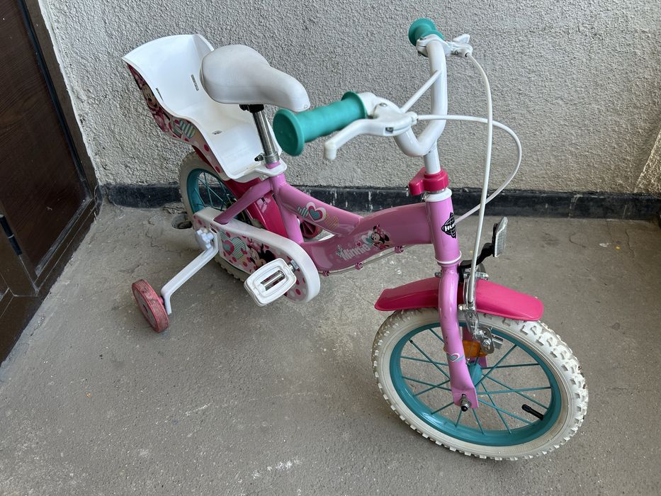Bicicletă fetițe Huffy Disney Minnie Mouse cu roți ajutătoare și scaun păpușă