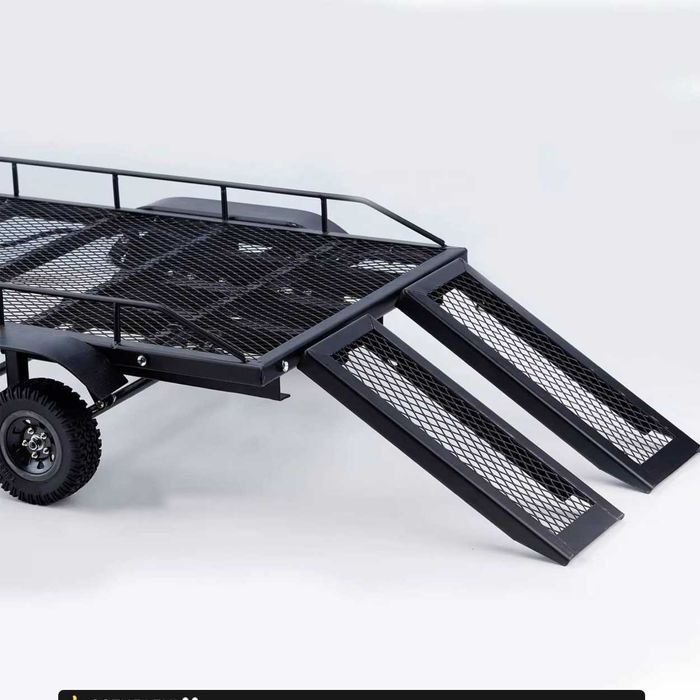 RC. Металлический прицеп с четырьмя
шинами для 1/10RC Crawler.