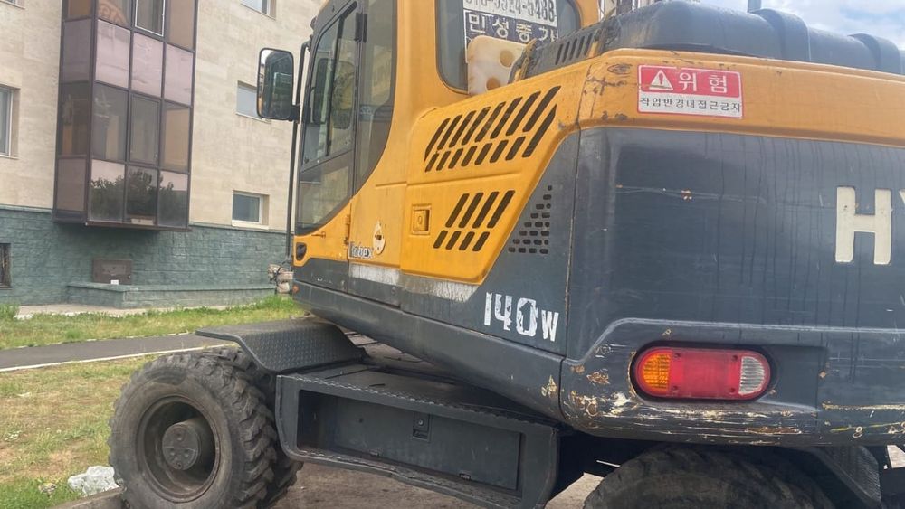 Колесный экскаватор