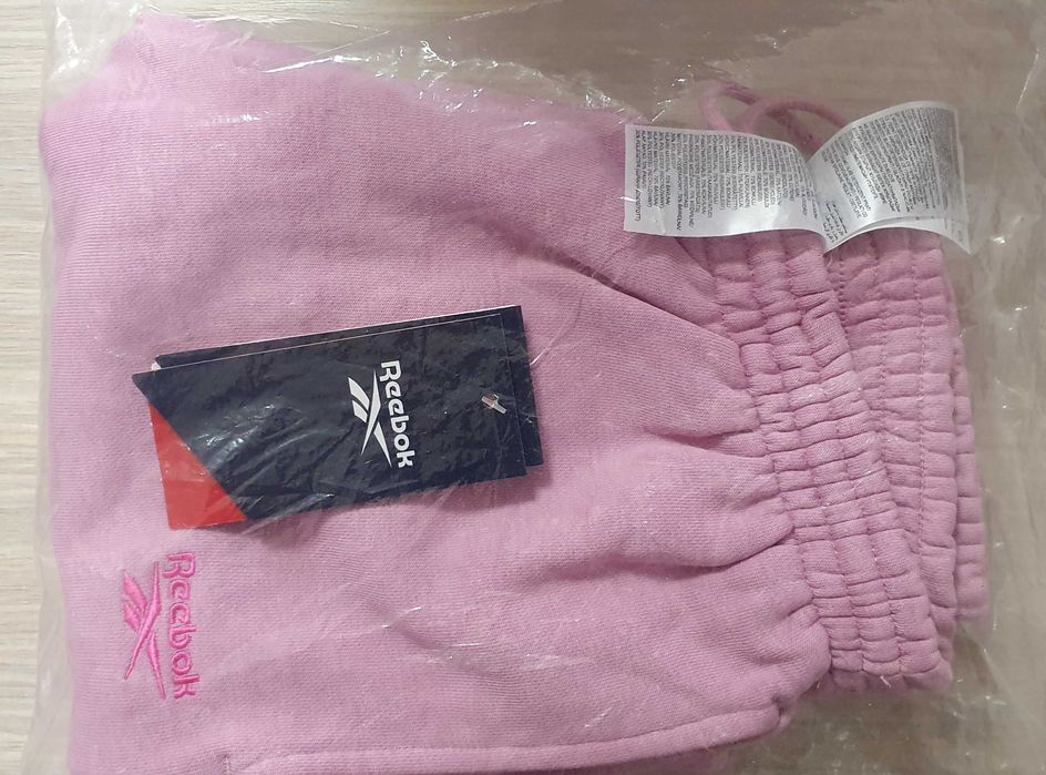 Pantaloni trening femei roz 100075640 Reebok FRENCH TERRY marimea XS