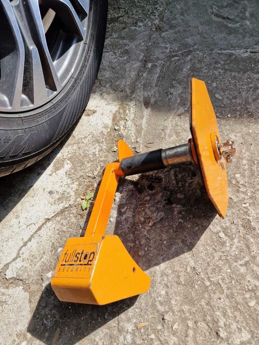 Sistem de bloca roți