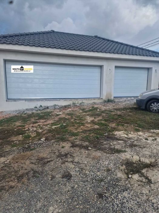 Distribuim la cel mai bun pret usi de garaj-TRANSPORT GRATUIT