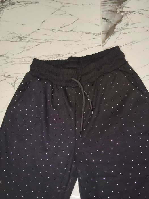 Pantaloni evazați cu pietricele de damă