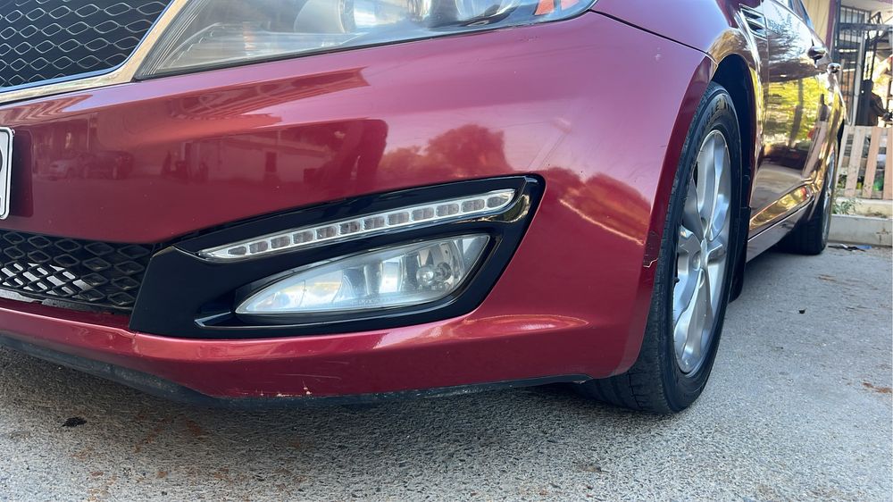 Губа переднего бампера kia optima