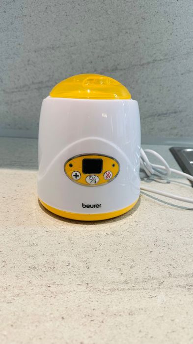 Уред за затопляне на бебешки шишета и бурканчета