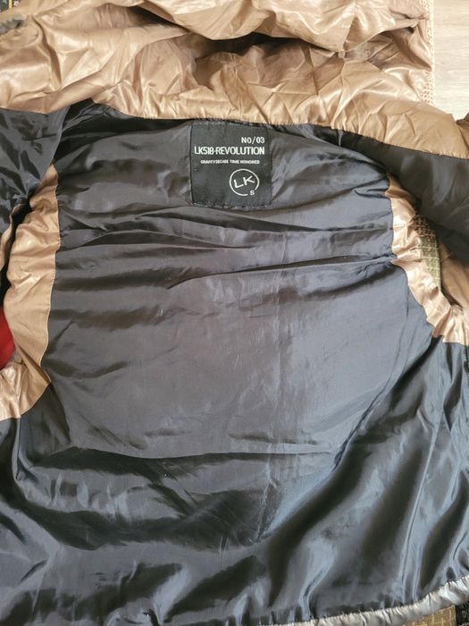 Пуховая жилетка новая