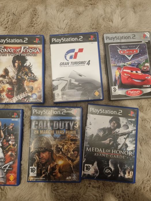 Playstation 2 cu 9 jocuri si controller